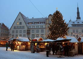 People shopping from market stalls at the Tallin Christmas market