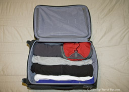 Luggage packing - Rolled up items of clothing in a carryon luggage