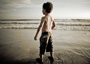 Kid alone on a beach