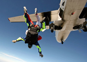 Man parachuting from airplane