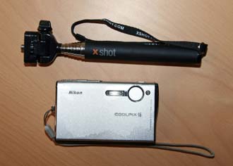 Pocket Xshot camera extender next to Nikon pocket camera