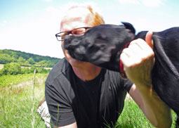 Dog licking his owner face