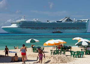 Cruise ship anchored closed to a beach