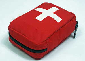Red colored first aid travel kit