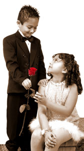 Boy giving girl flower as romantic gesture