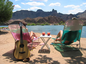 two people in sun lounge chairs