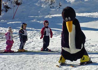 Kids skiing on a family ski vacations