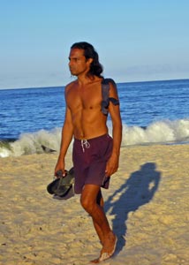 Man walking in swimwear on Brazilian beach