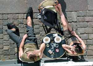 Couple drinking coffee in outside coffee shop