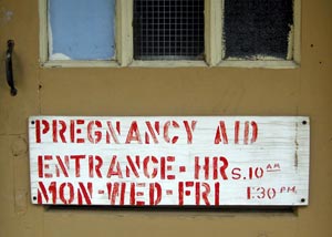 Sign for pregnancy clinic opening hours