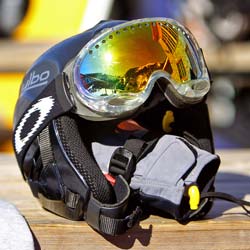Ski helmet with ski goggles on a table