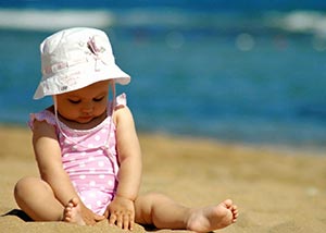 Toddler sitting on beach