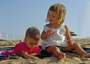 Two kids playing on a beach
