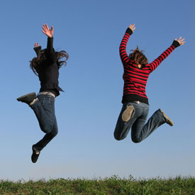 Traveling teenagers jumping