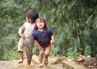 Two children playing in small village in Sapa Vietnam