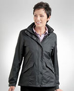 Woman wearing dark colored rain jacket