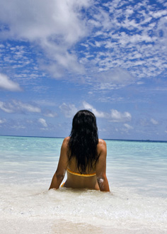 Single woman watching the sea